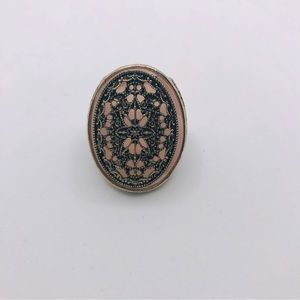 Unique pink ring with intricate details